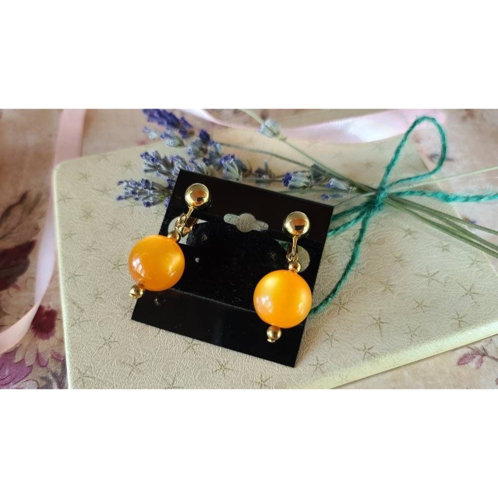 Celebrity Orange Dangling Clip-on Earrings